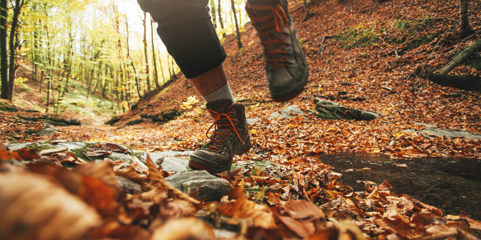 hiking boots with fall leaves